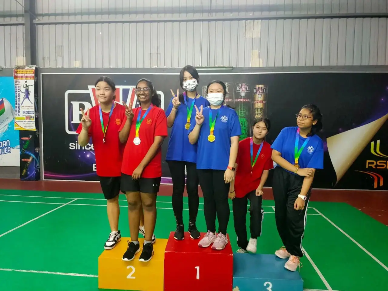 Students on the podium at a sports competition